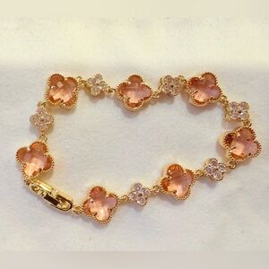 Gold-Tone Bracelet with Pink Clover Motif Stones
